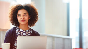 Woman attending a building resilience workshop and proven resilient leadership training through her organization's resilience training for employees via an online, research-based resilience course, "Burn Bright: The Resilience Advantage" from the Center for Creative Leadership