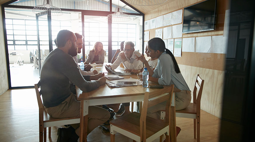 Creative people at a brainstorm meeting discussing the biggest challenges leaders face today