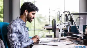 Man contemplating the value of coaching to improve performance & how coaching improves performance as well as how to get the most from a leadership coaching opportunity