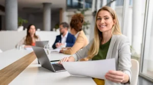 Photo of woman smiling looking at CCL Leadership Research Papers and Leadership Development Reports and Leadership Journal Publications