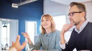 image of people having a conversation on the importance of developing soft skills for leaders