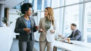 Two people at work discussing vertical development vs. horizontal development