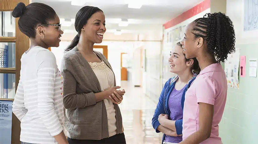 Professional woman mentoring girls